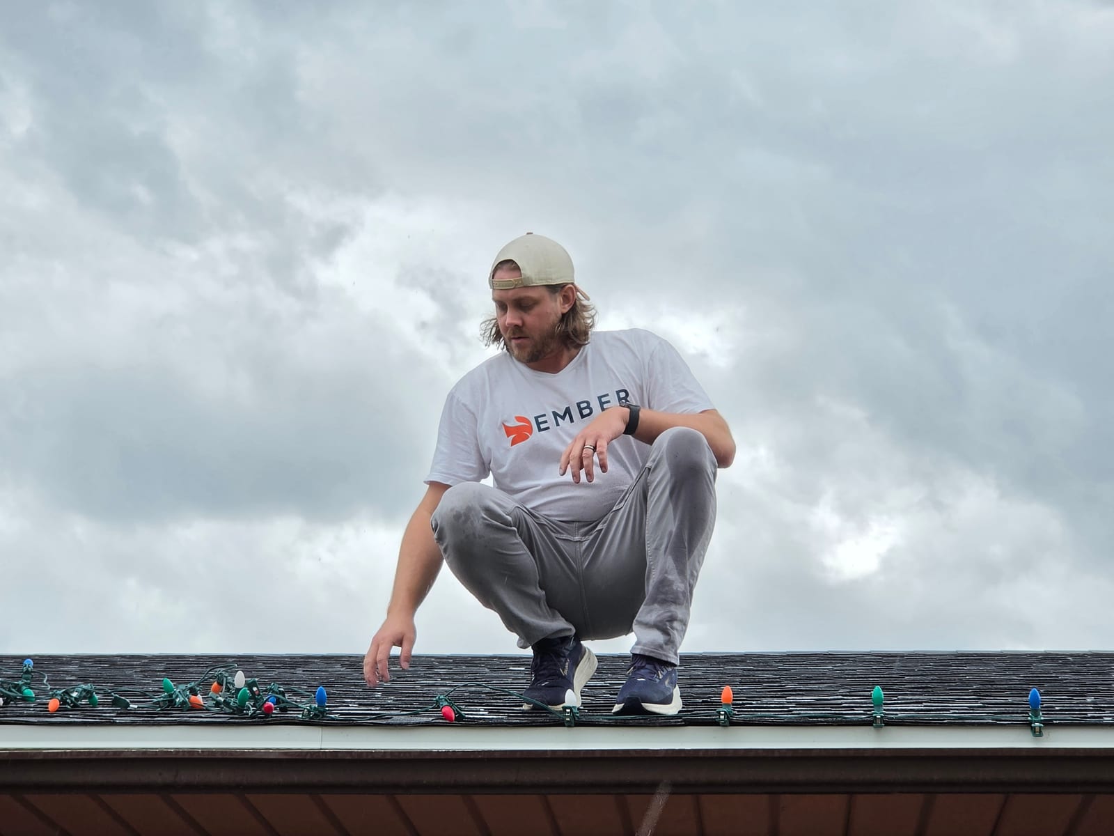Christmas light installation in Salt Lake City — Ember installer setting C9 bulbs along a roofline