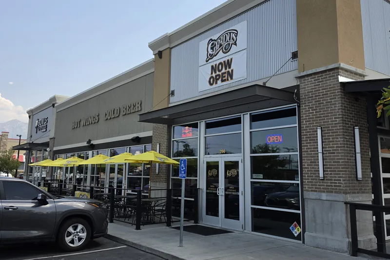 Storefront glass and entry doors cleaned by Ember Window Cleaning at a Midvale, Utah restaurant